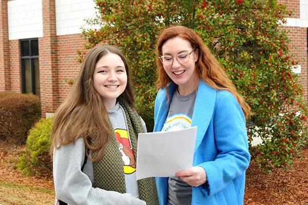 Advisor providing new student with directions